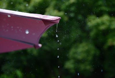 Water dripping of off an umbrella or seamless gutter