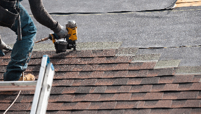 Person installing roofing